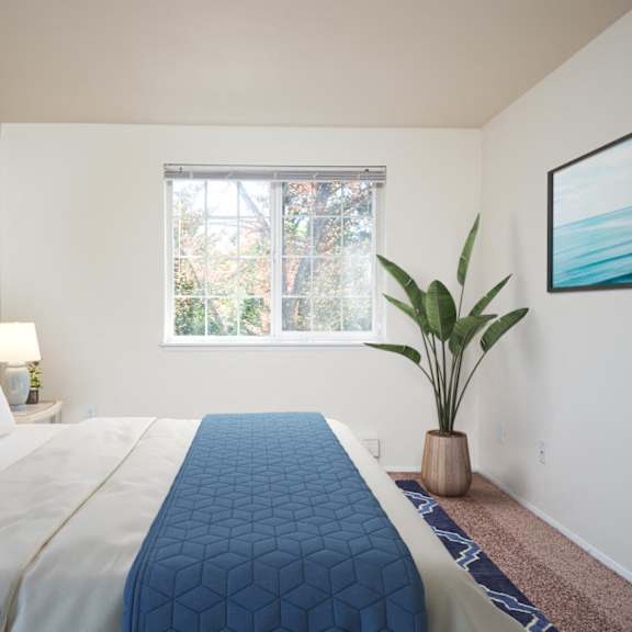 a bedroom with a large bed and a window at sundial apartments, oregon, 97070