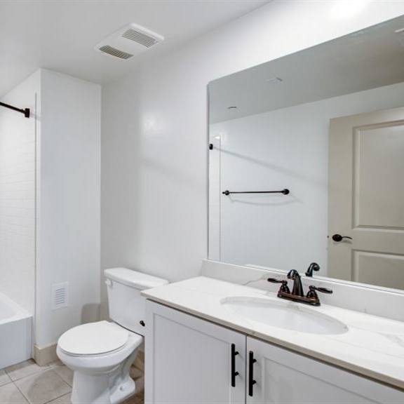 renovated bathrooms with quartz counters at arrive los carneros, goleta, california