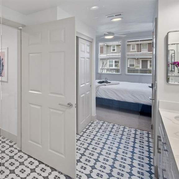 walk-in showers with built-in bench and glass enclosure at arrive los carneros ii, california, 93117