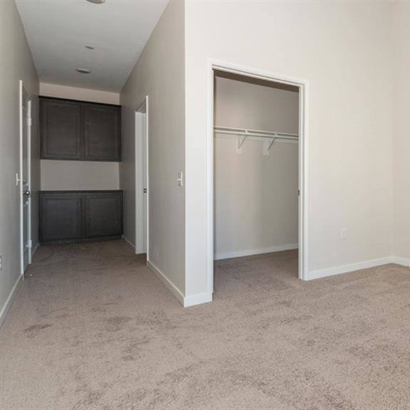 carpeted living area at arrive at rancho belago, moreno valley, ca, 92555