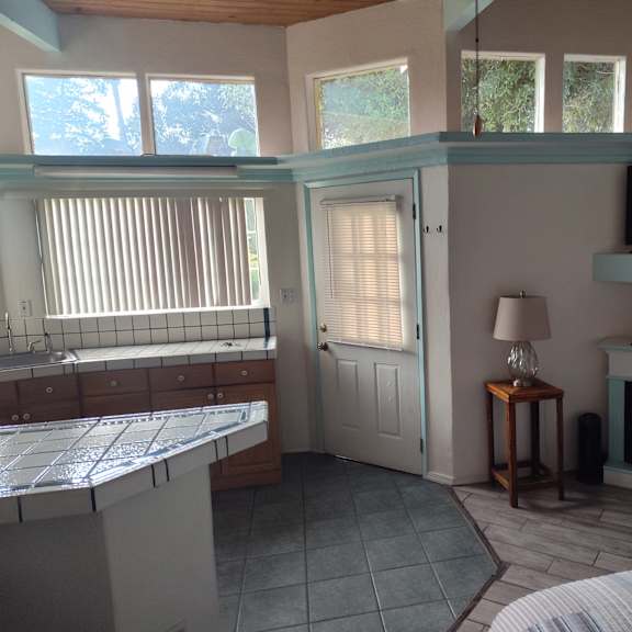 a living room with a fireplace and a television at salinas sunset apartments, salinas, california