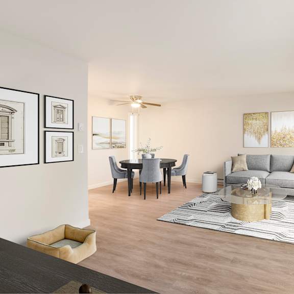a modern living room with a dining table and grey sofa.