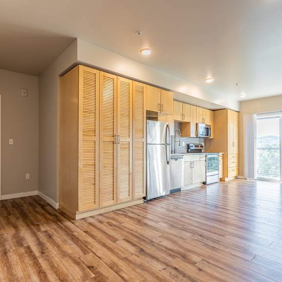 open concept studio with kitchen and living area at brooklyn yard apartments, oregon