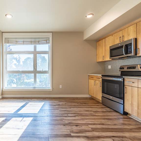 bright open living area with natural sunlight streaming in at brooklyn yard apartments, portland, oregon