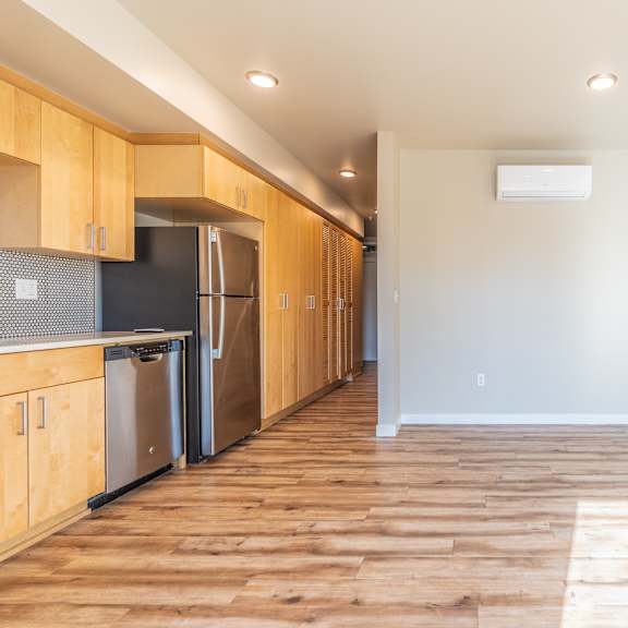 open studio with galley kitchen and hardwood flooring at brooklyn yard apartments, oregon