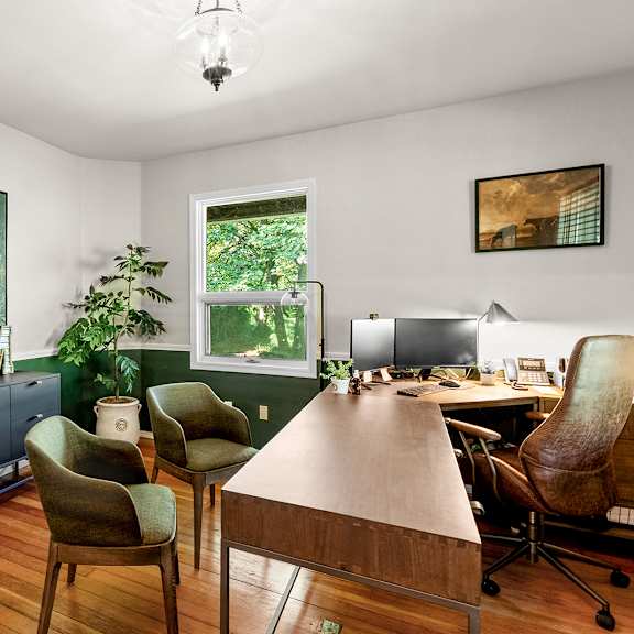 leasing office with a desk and chairs