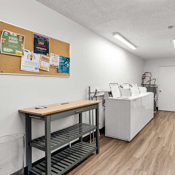 a clean, well-organized medical or dental office with a cork board on the wall.