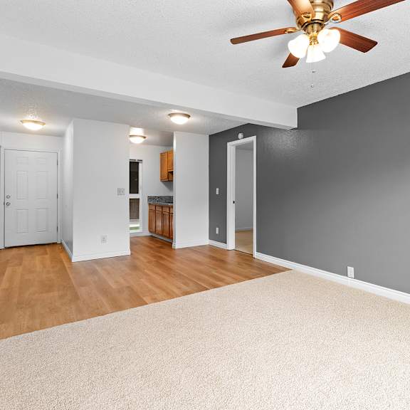 a room with a ceiling fan and a carpeted floor.at east wind, oregon, 97030