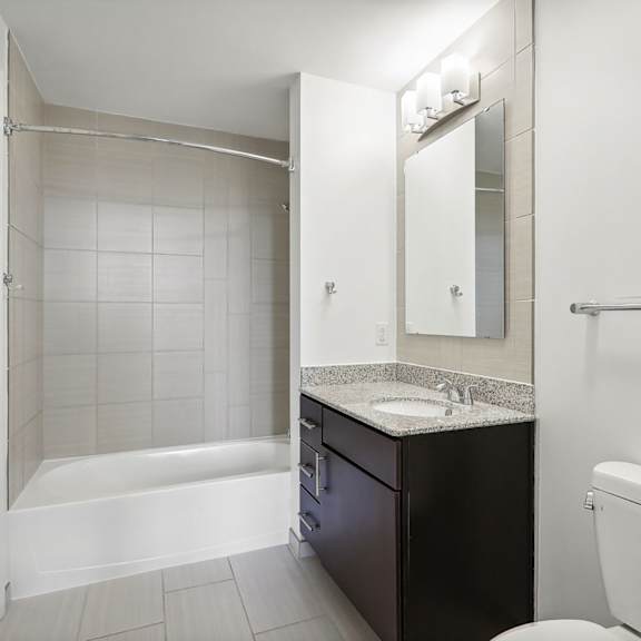 a bathroom with a sink toilet and a shower