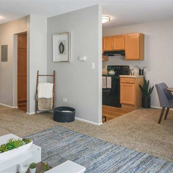 a living room with a dining room and a kitchen at renew aurora, aurora, il, 60506