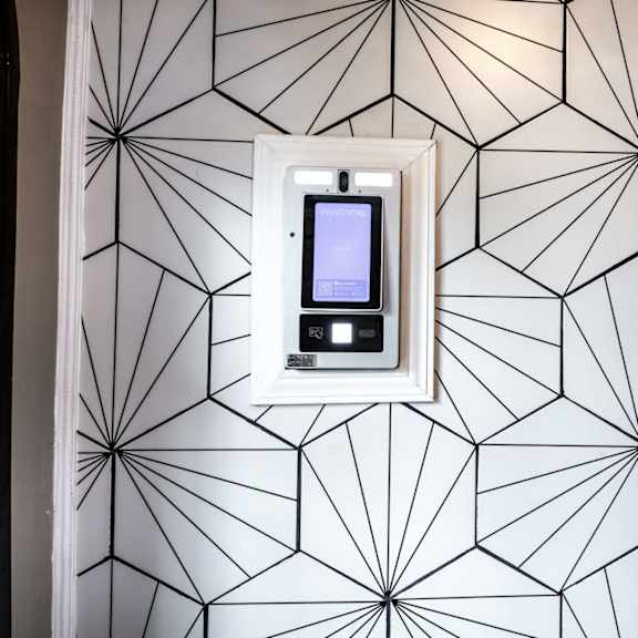door lock on patterned wallpaper at evelyn apartments, oak park