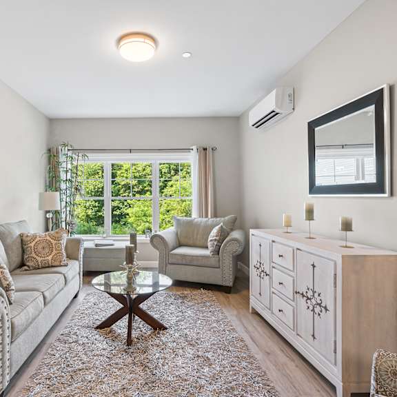 a living room with a couch and two chairs at lofts at 335, stratford, ct