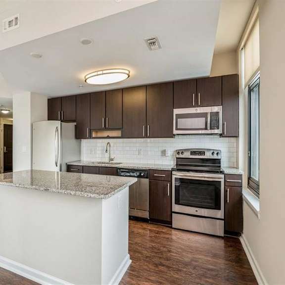 kitchen with cabinets at arrive wheaton, wheaton