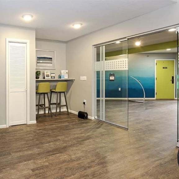 clubhouse interior with white and blue wall colors at twelve 501 apartment homes, burnsville, mn