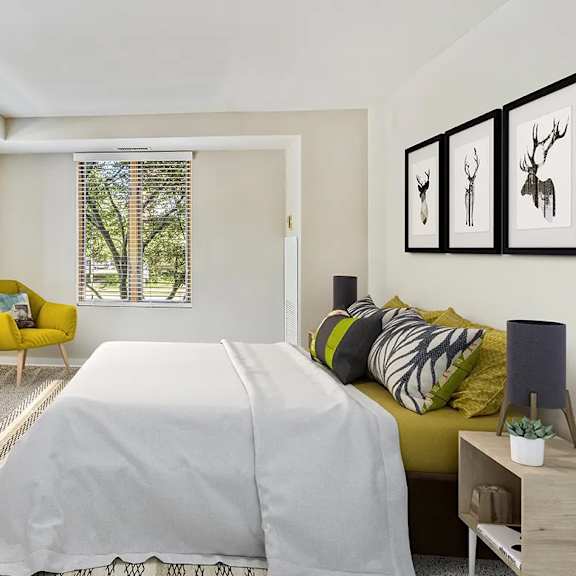 a bedroom with a large bed, a yellow chair, and a wooden dresser. at oak park city, oak park, il 60301