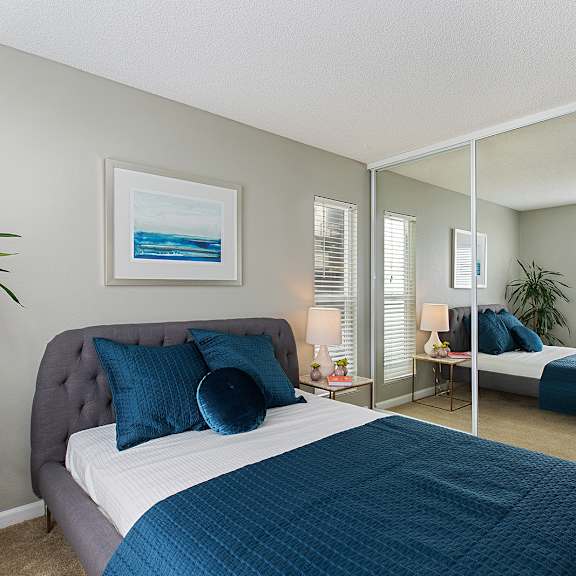 furnished bedroom interior at oceanaire apartment homes, pacifica