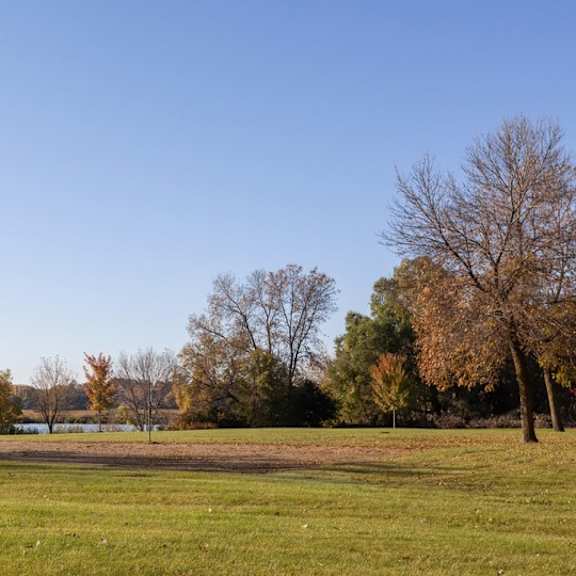 green landscape near lake at renew at neill lake, eden prairie