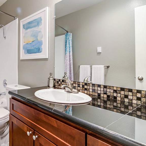 a bathroom with a sink toilet and bathtub at the bluffs at mountain park, oregon, 97035