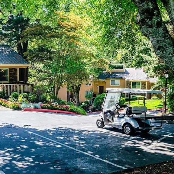 a golf cart parked in front of a house  at the bluffs at mountain park, lake oswego, or