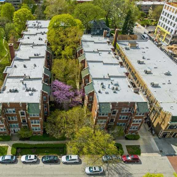 an aerial view of a building next to a parking lot at the bryant at oak park i & ii, oak park, il