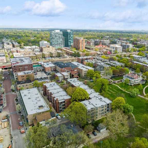 an aerial view of a city with buildings and trees at the bryant at oak park i & ii, illinois
