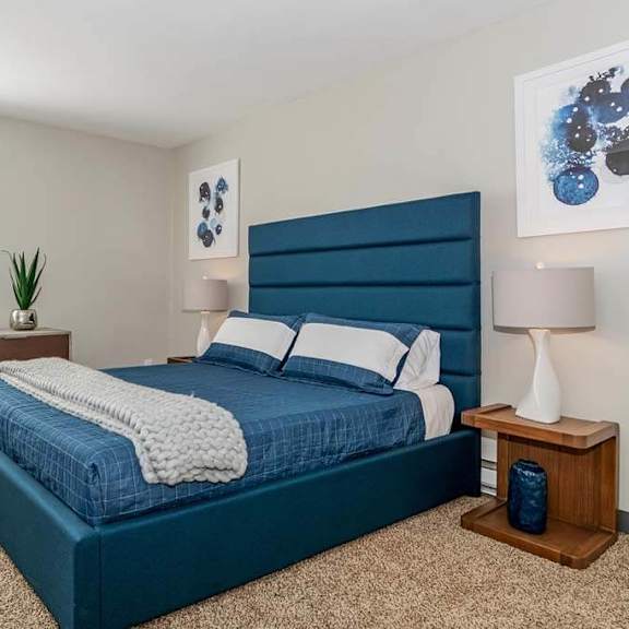 bedroom with a bed and a dresser at renew madison, madison