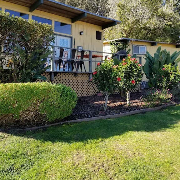 yellow cabin with deck and landscaping at salinas sunset apartments, california, 93907