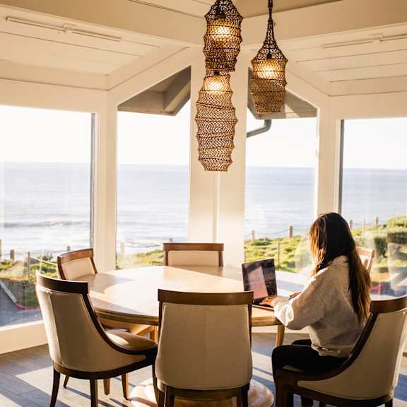 woman working in the community room at oceanaire