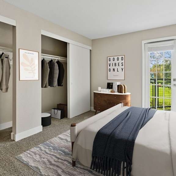 a bedroom with a bed, a dresser, and a window with a view of trees.