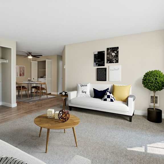 a living room with a white couch and a coffee table.