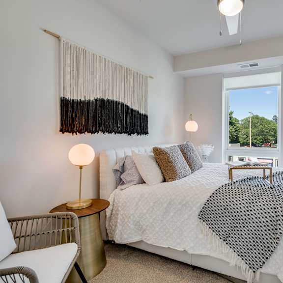 bedroom with a large bed and a chair at the shale, minnesota