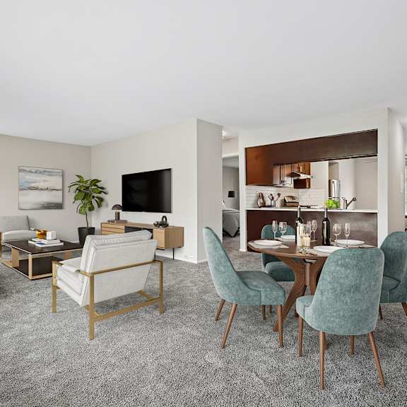 a living room with a grey carpet and furniture.
