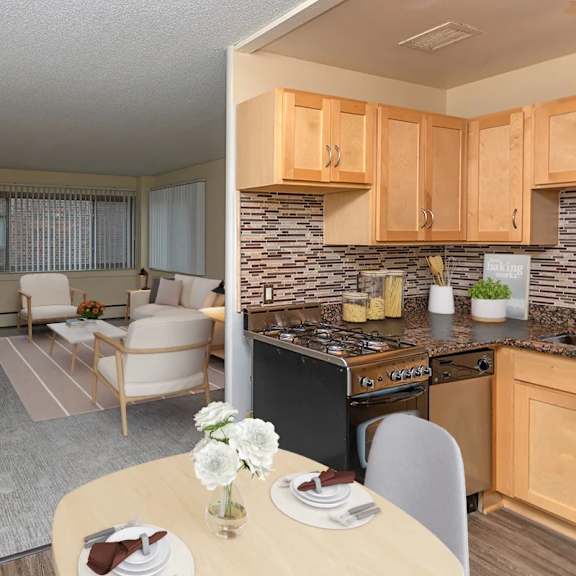 kitchen and dining table at the venue on knox apartments, minneapolis, 55408