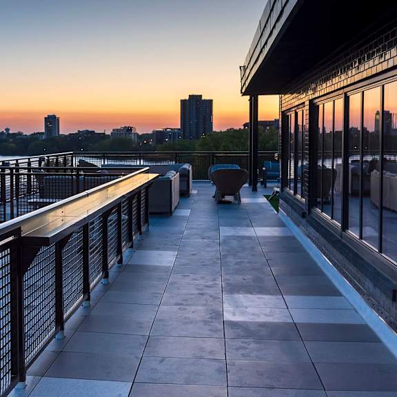 balcony overlooks body of water at the venue on knox apartments, minneapolis, mn, 55408