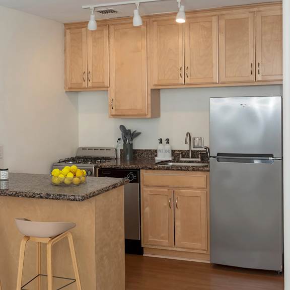 equipped kitchen at the venue on knox apartments, minneapolis