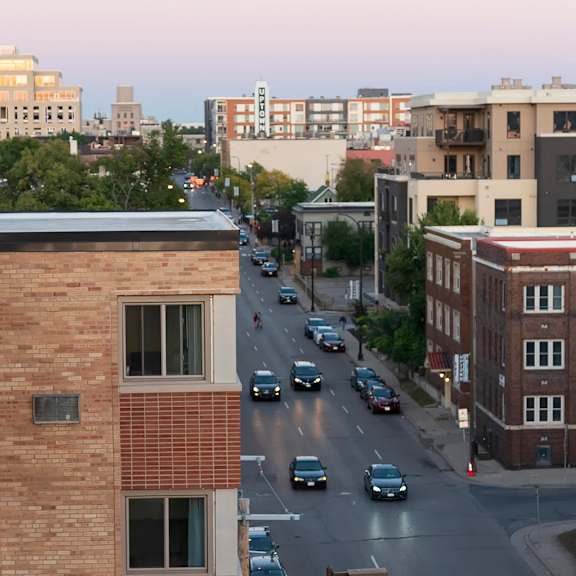 view of city street at dusk at the venue on knox apartments, minneapolis, minnesota