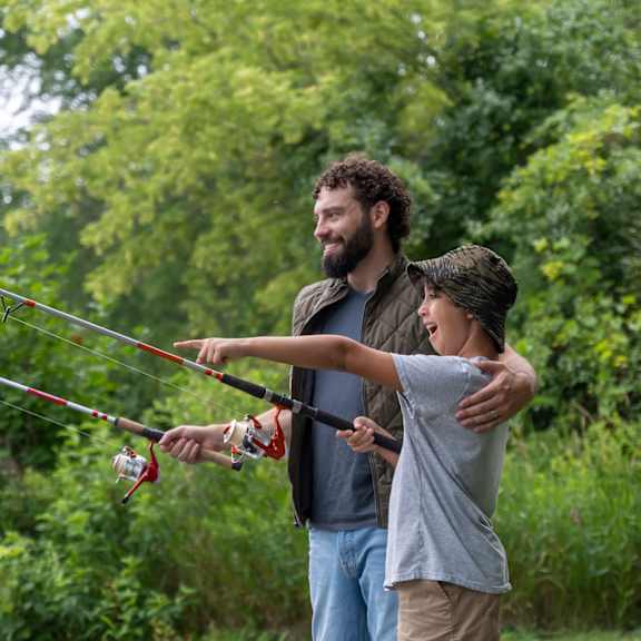 a man and a child fly fishing