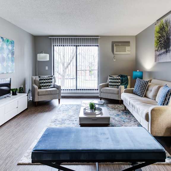 our apartments offer a living room with a couch coffee table and tv