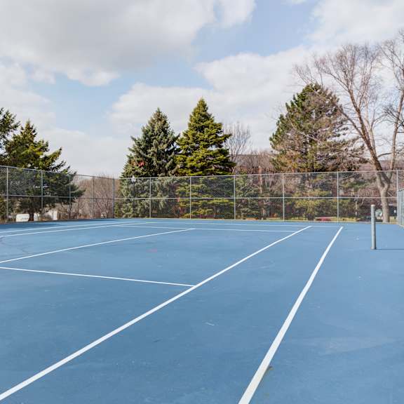 a tennis court at the reserve at riverdale apartments in riverdale, nj
