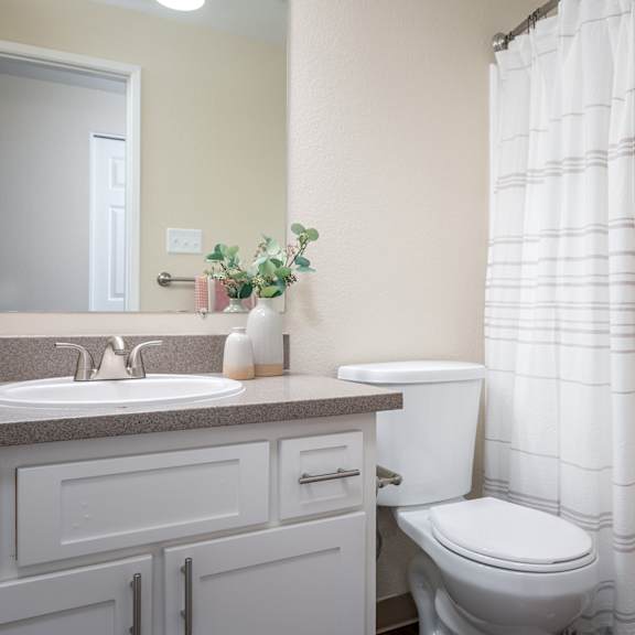 a bathroom with a sink toilet and a shower at sundial apartments, wilsonville, 97070