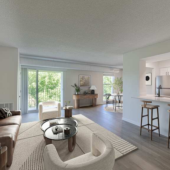a modern living room with a kitchen in the background.