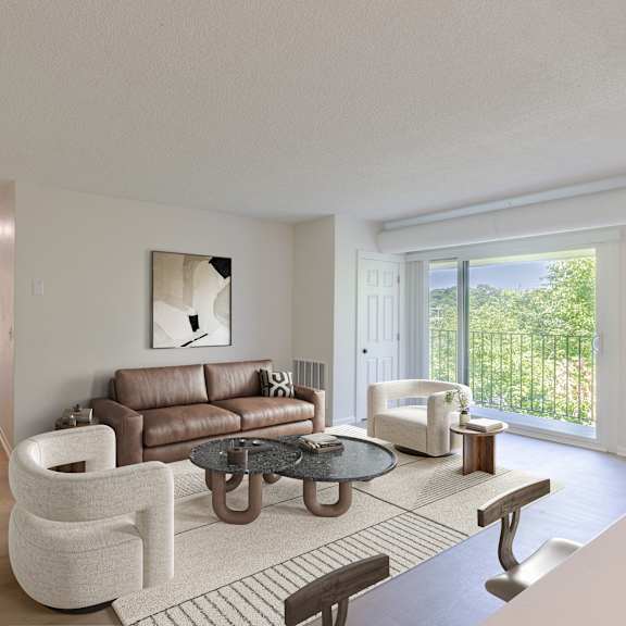a living room with a brown couch and a white chair.