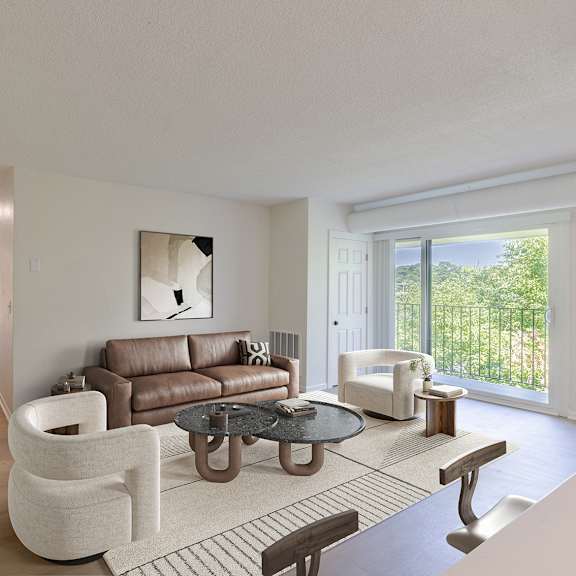 a modern living room with a brown leather couch and a white chair.