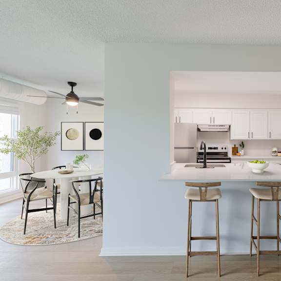 a kitchen with a bar area and a dining table.