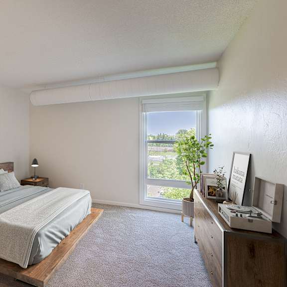 a bedroom with a large bed and a painting on the wall.