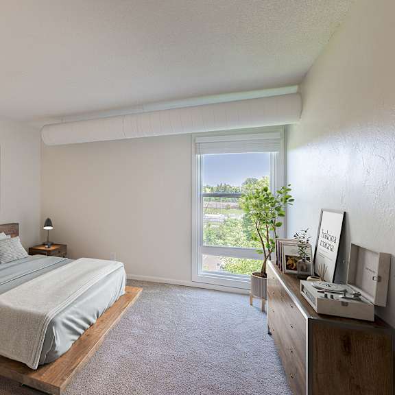 a bedroom with a large bed and a painting on the wall.