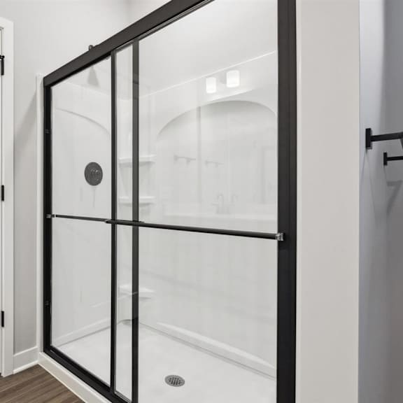 a white door with a black handle and a black frame.