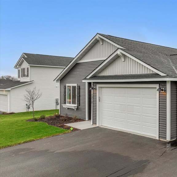 a two-car garage is attached to a house.