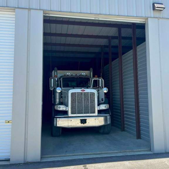 a large truck is parked in a garage.