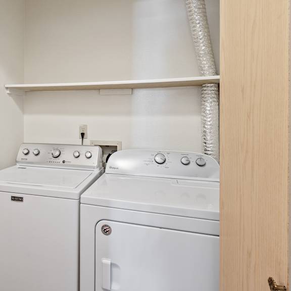 the washer and dryer in the laundry room of a home